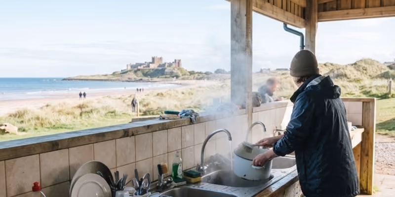 The covered washing-up bay, someone at the sink with the castle beyond